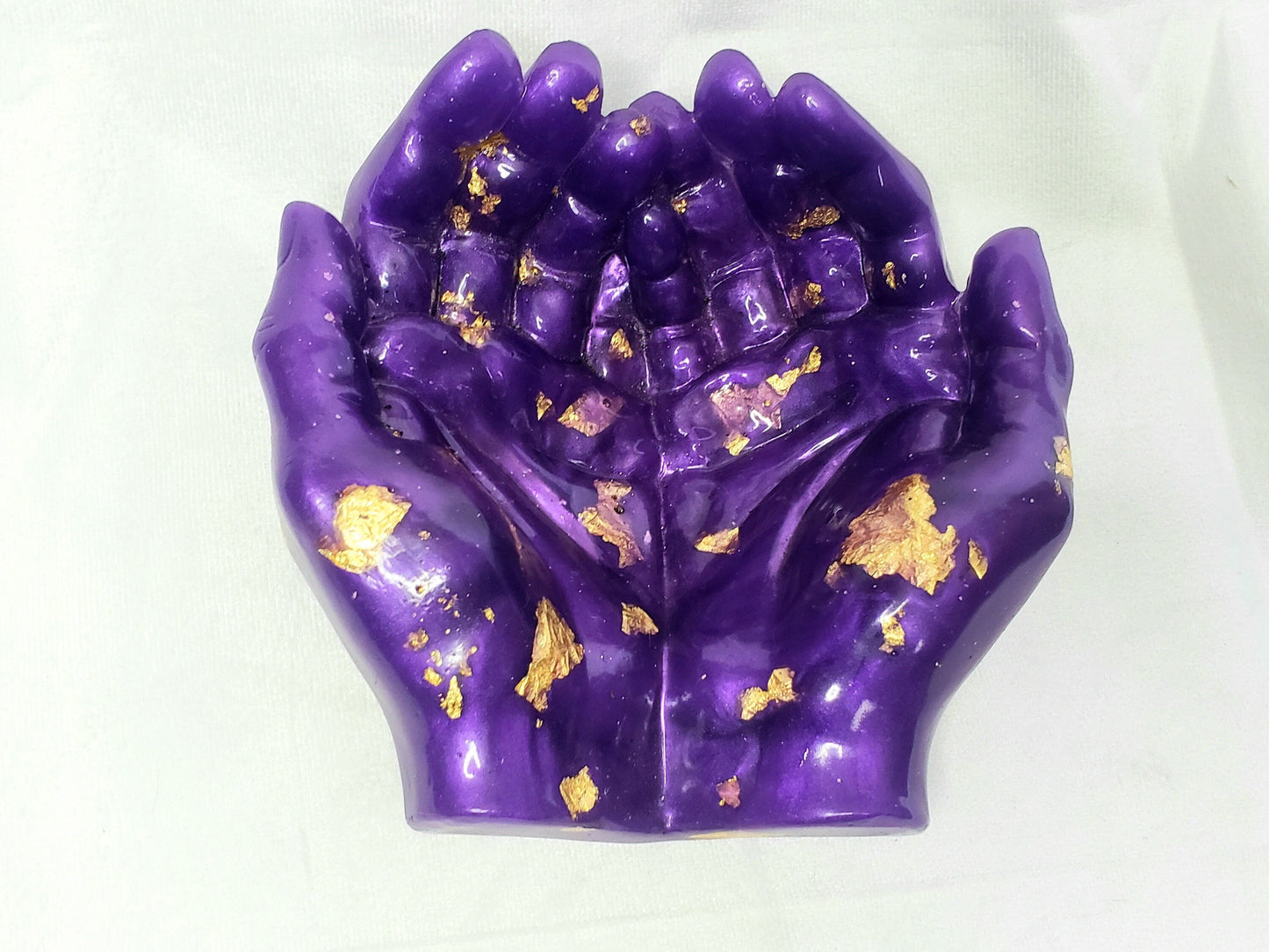 purple and gold resin hands holder